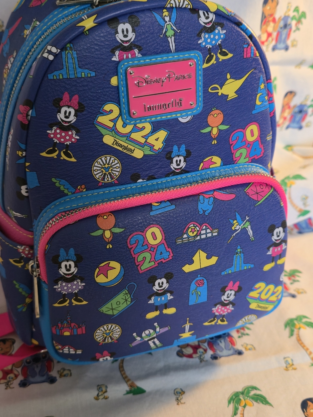Disney Parks 2024 LOUNGEFLY Mini Backpack in Blue, Pink & Yellow